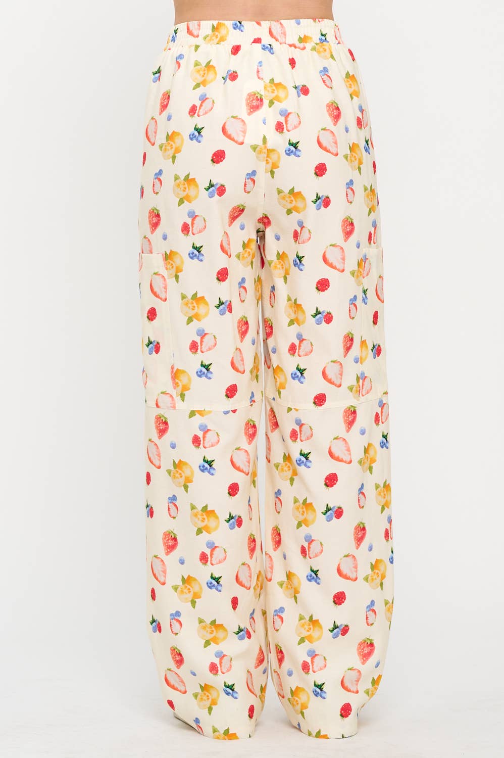 Back view of berry wide-leg cargo pants with an elastic waistband and a flowy silhouette, showcasing the lightweight fabric and vibrant print.