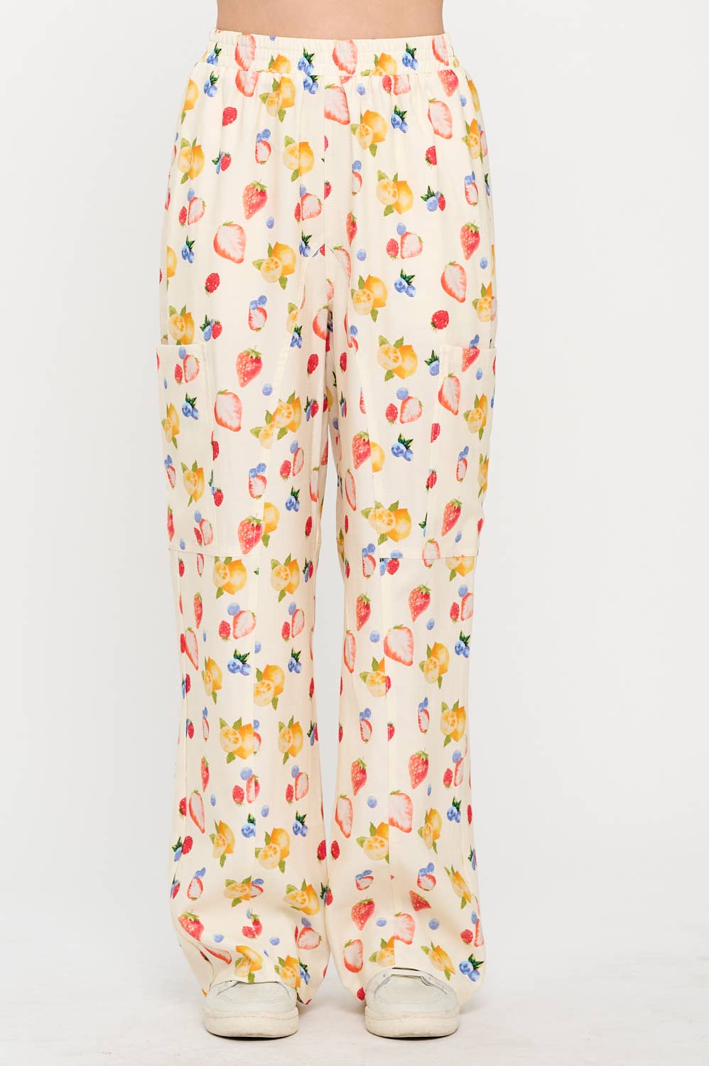 Front view of floral wide-leg pants with a high waist and breezy fabric, featuring a colorful berry and lemon pattern perfect for a casual, chic outfit.